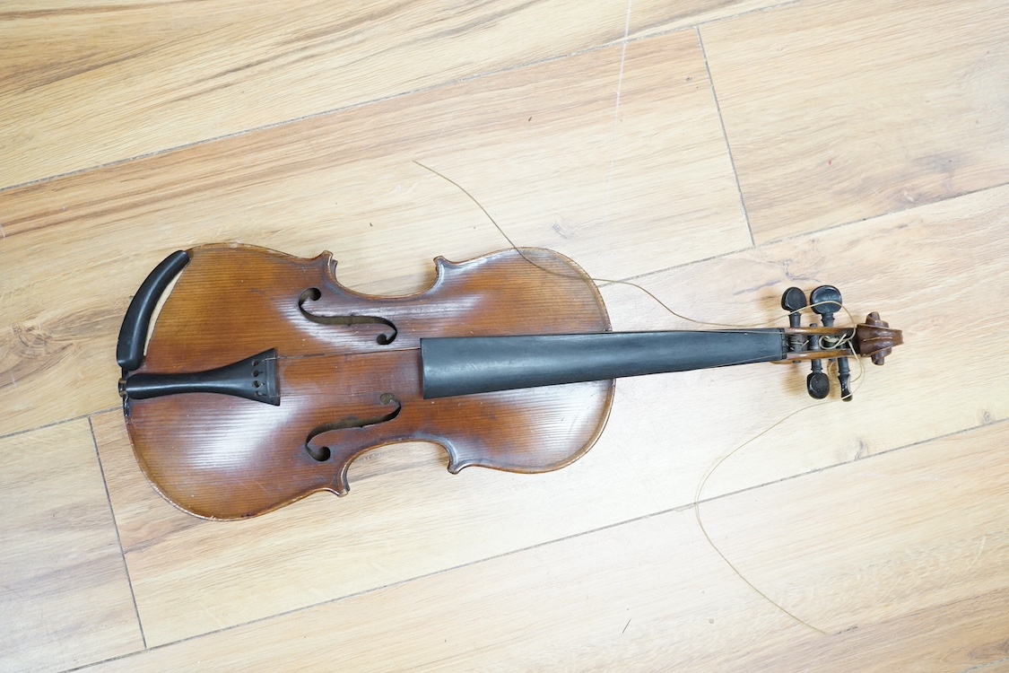 A quarter-size German violin, back measures 31cm. Condition - fair